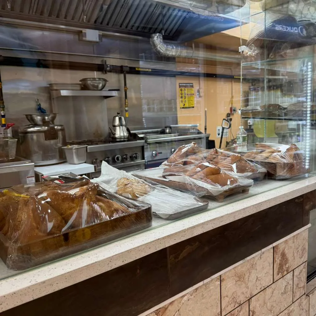 Inside the Al Reef bakery kitchen and display case