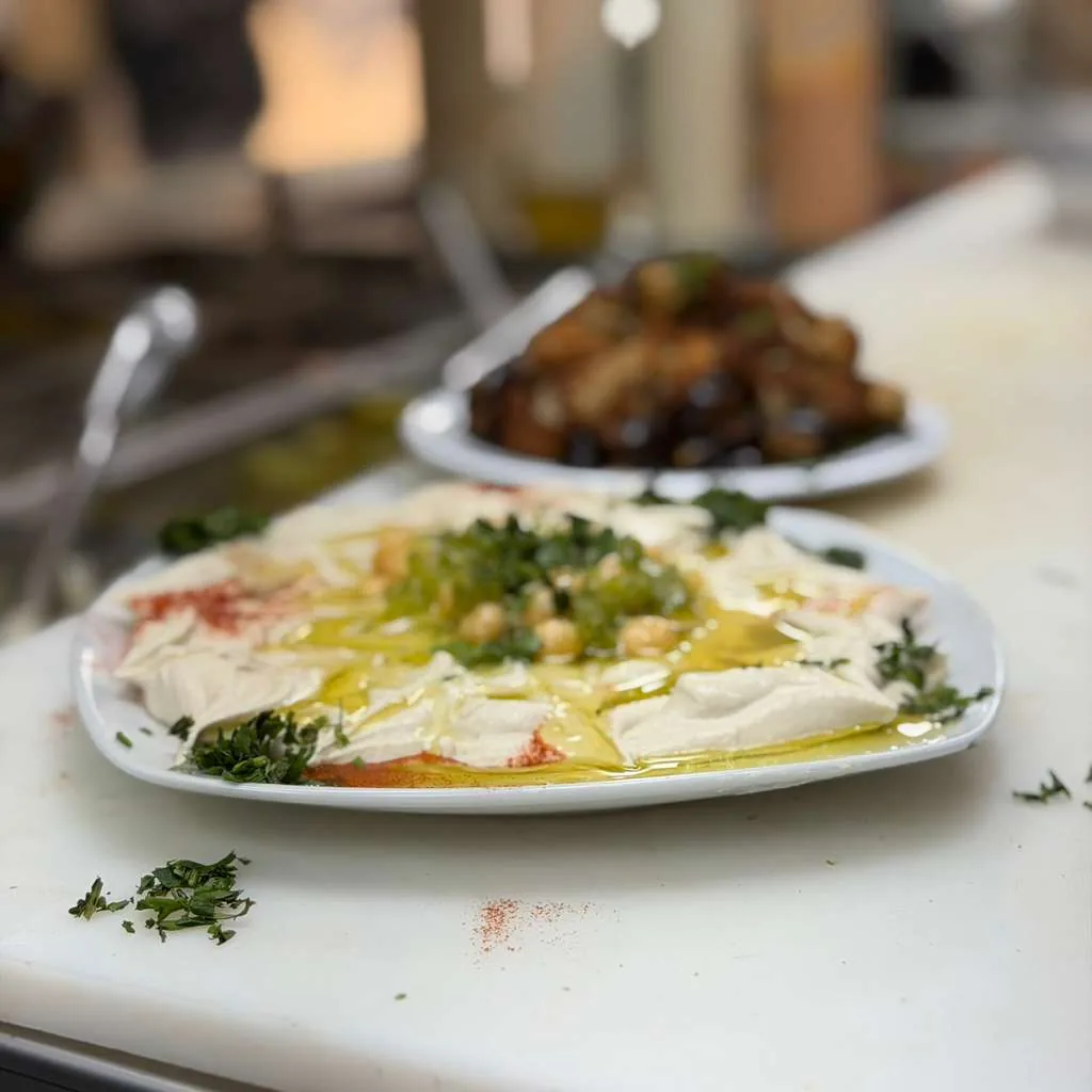 Fresh hummus plate drizzled with olive oil