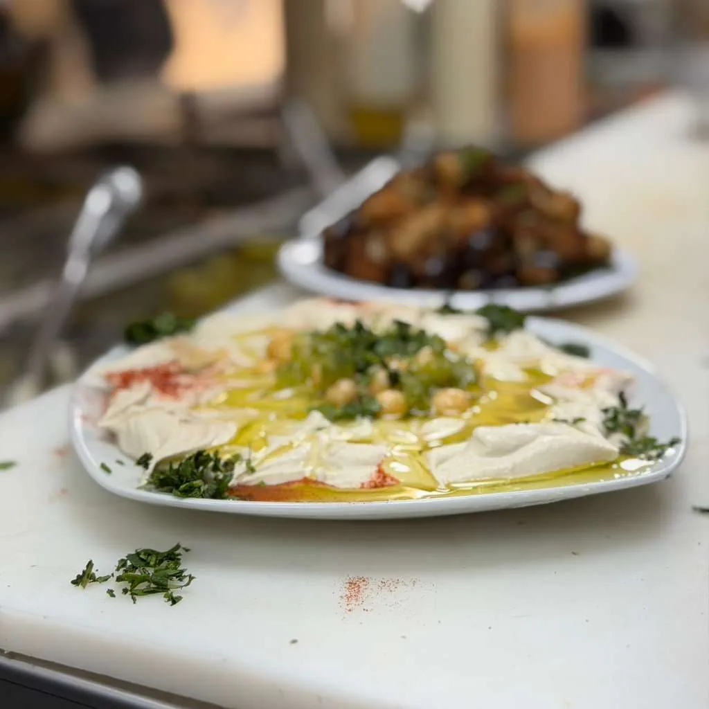 Hummus plate with olive oil and chickpeas