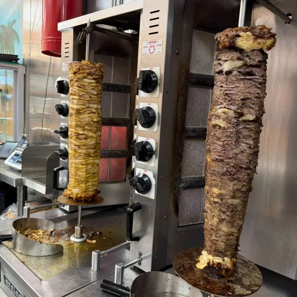 Chicken shawarma roasting on the spit