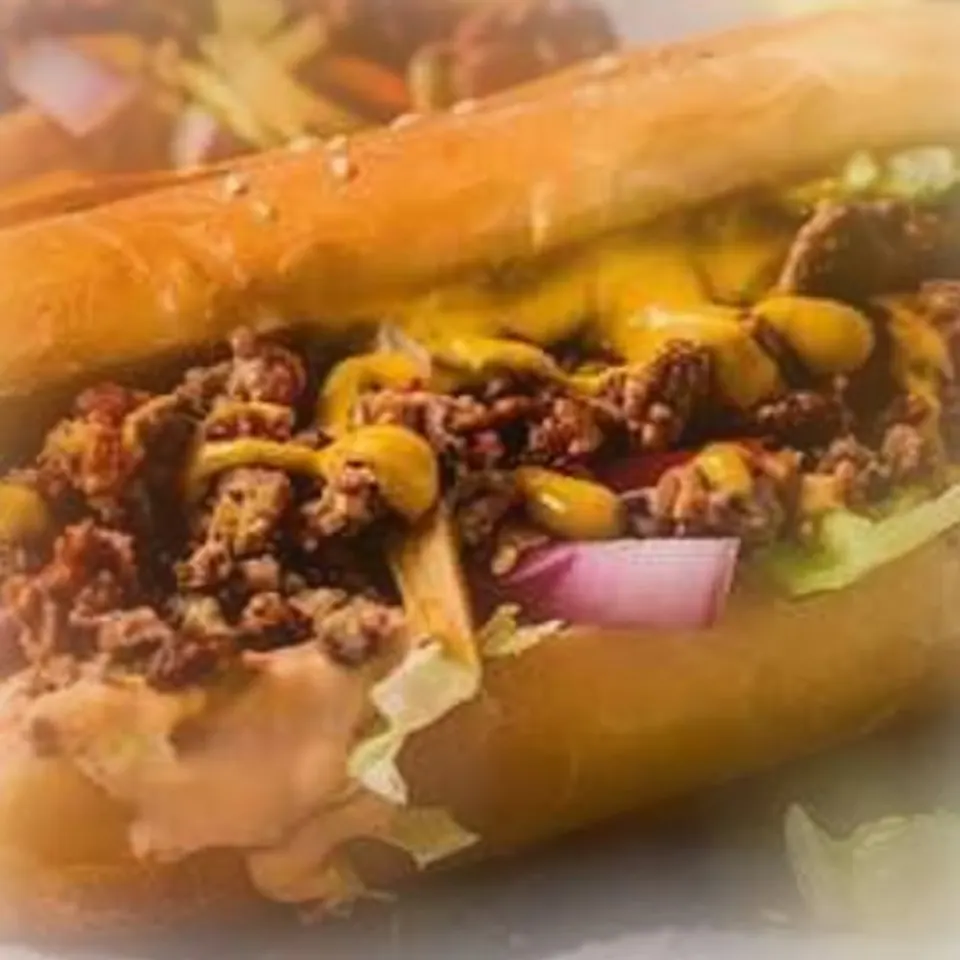 Philly cheesesteak on a toasted roll with beef and melted cheese