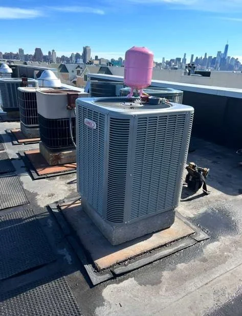 Lennox rooftop AC maintenance with city skyline