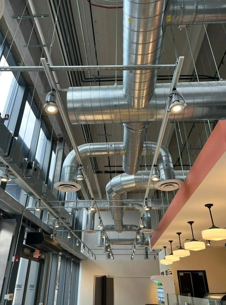 Commercial rooftop HVAC unit installation on flat roof